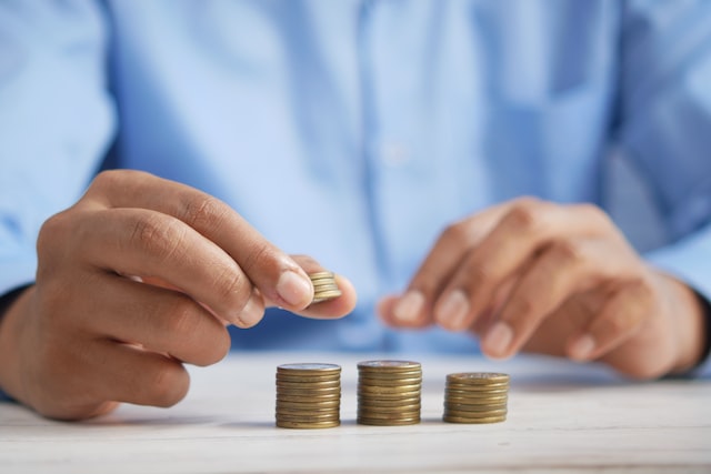 man saving coins